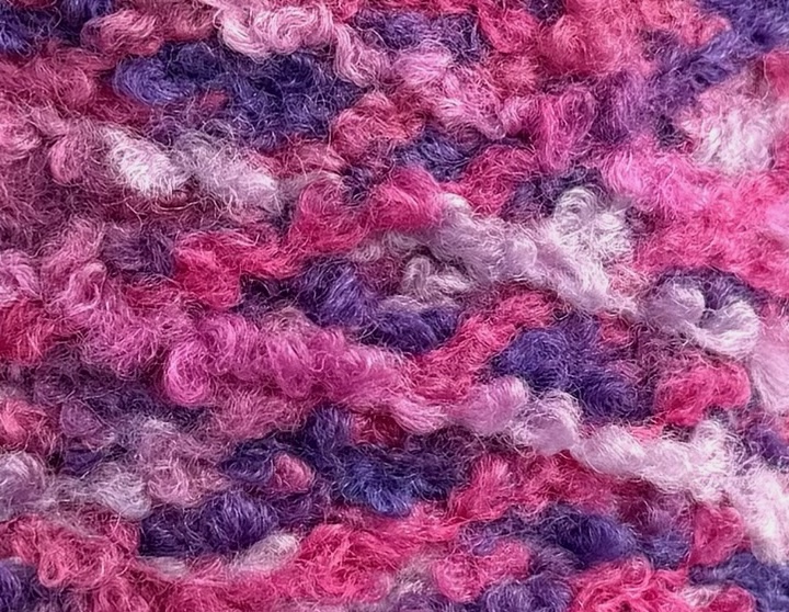 Corallo Bouclé 240m/100g – Merino Extrafine und Seide mit Elastan Pink-Lila Melange